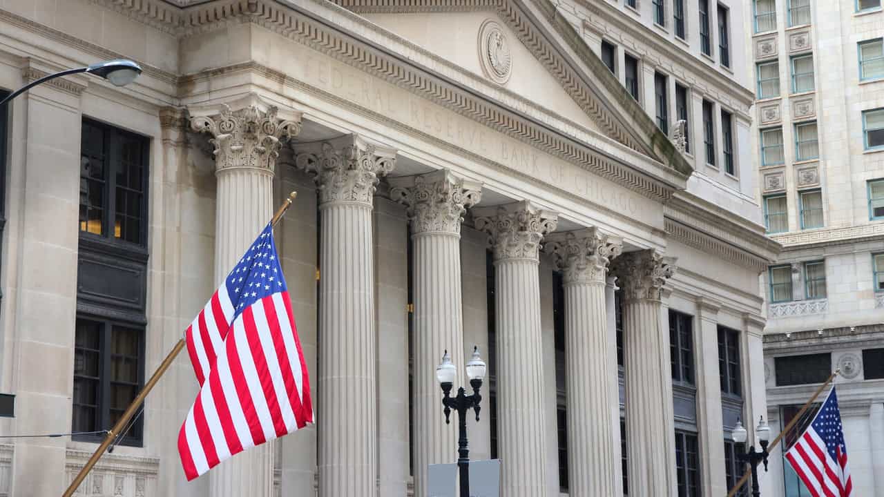 Federal Reserve interest rate direction illustration with economic trends and business impact